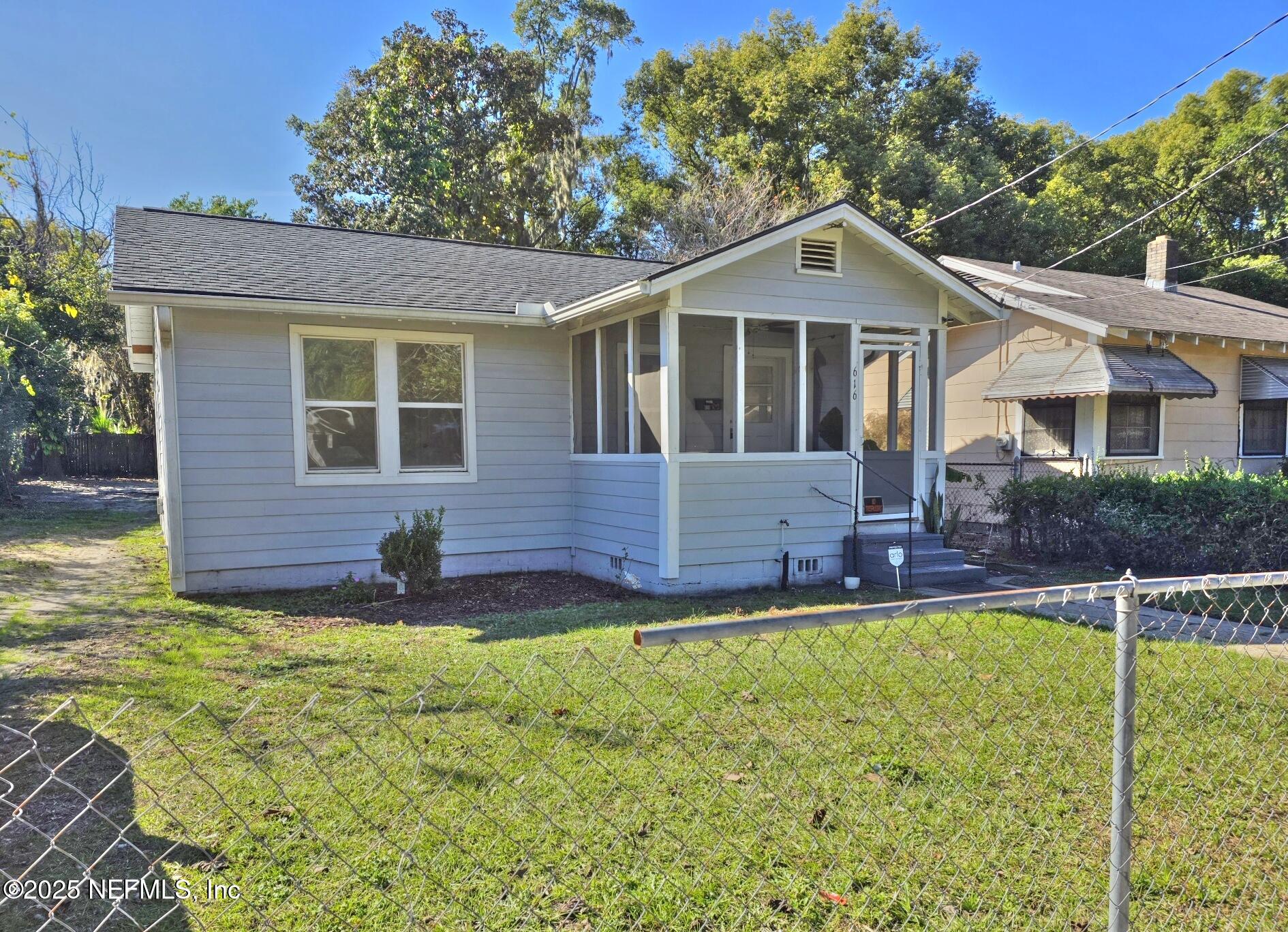616 Woodbine Street Jacksonville, FL 32206 - Photo 3 of 25 a front view of a house with a yard