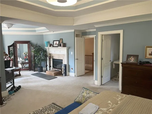 a view of a livingroom with furniture and a fireplace