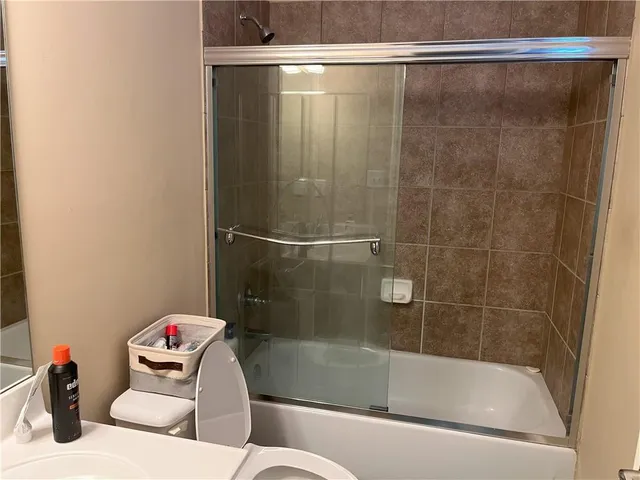 a bathroom with a shower and a bathtub