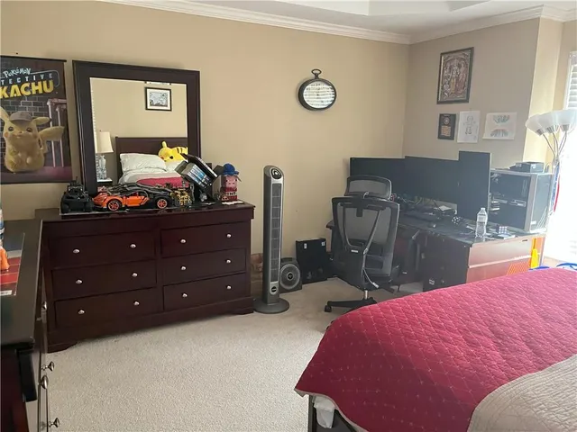 a bed room with a bed and a dresser