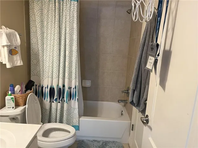 a bathroom with a toilet and a bathtub