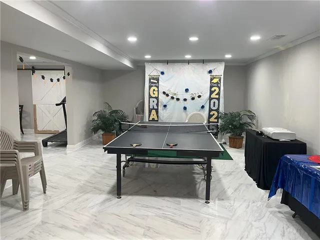 a living room with furniture and a rug