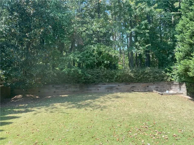 a view of a swimming pool with an outdoor space
