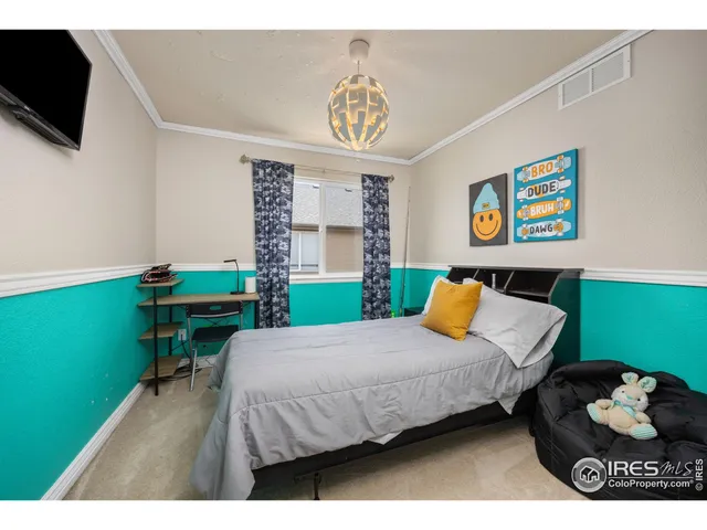 a bedroom with a bed and a table in it