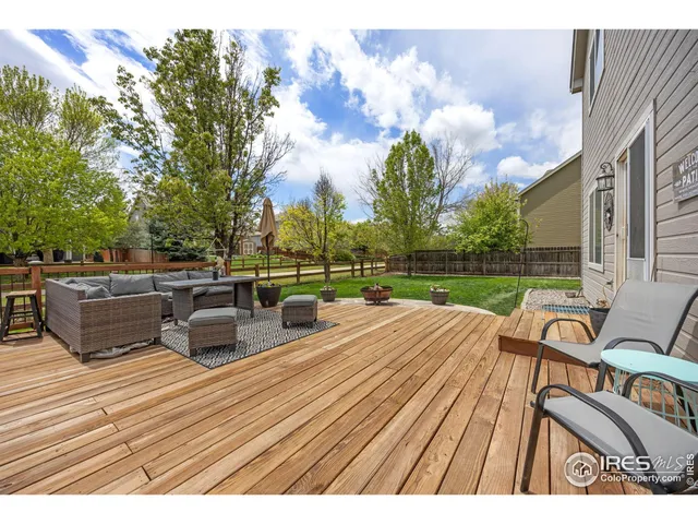 a view of a patio with couches and a fire pit