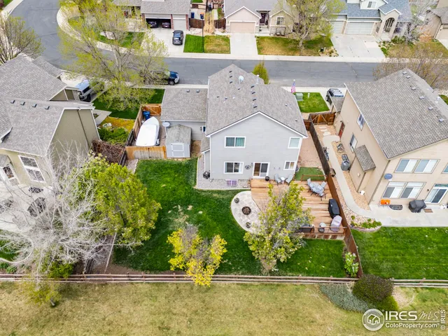 a view of a city with lots of residential buildings ocean and mountain view in back