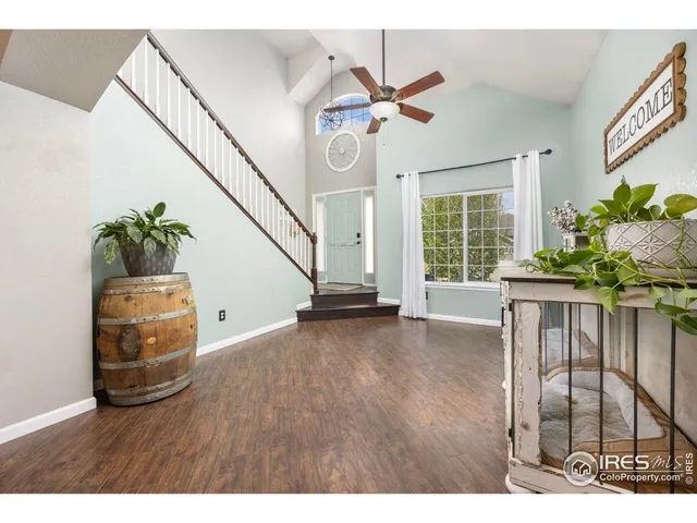 a view of an entryway with wooden floor