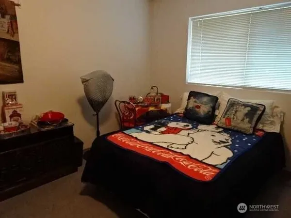 a bed room with furniture and a window