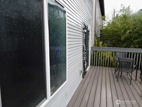 a view of balcony with wooden floor