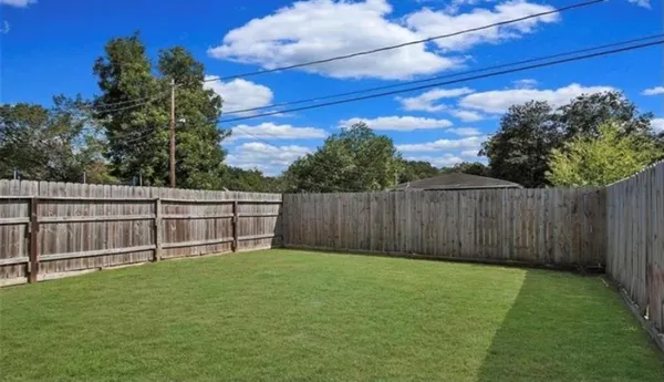 a view of a backyard with a small garden