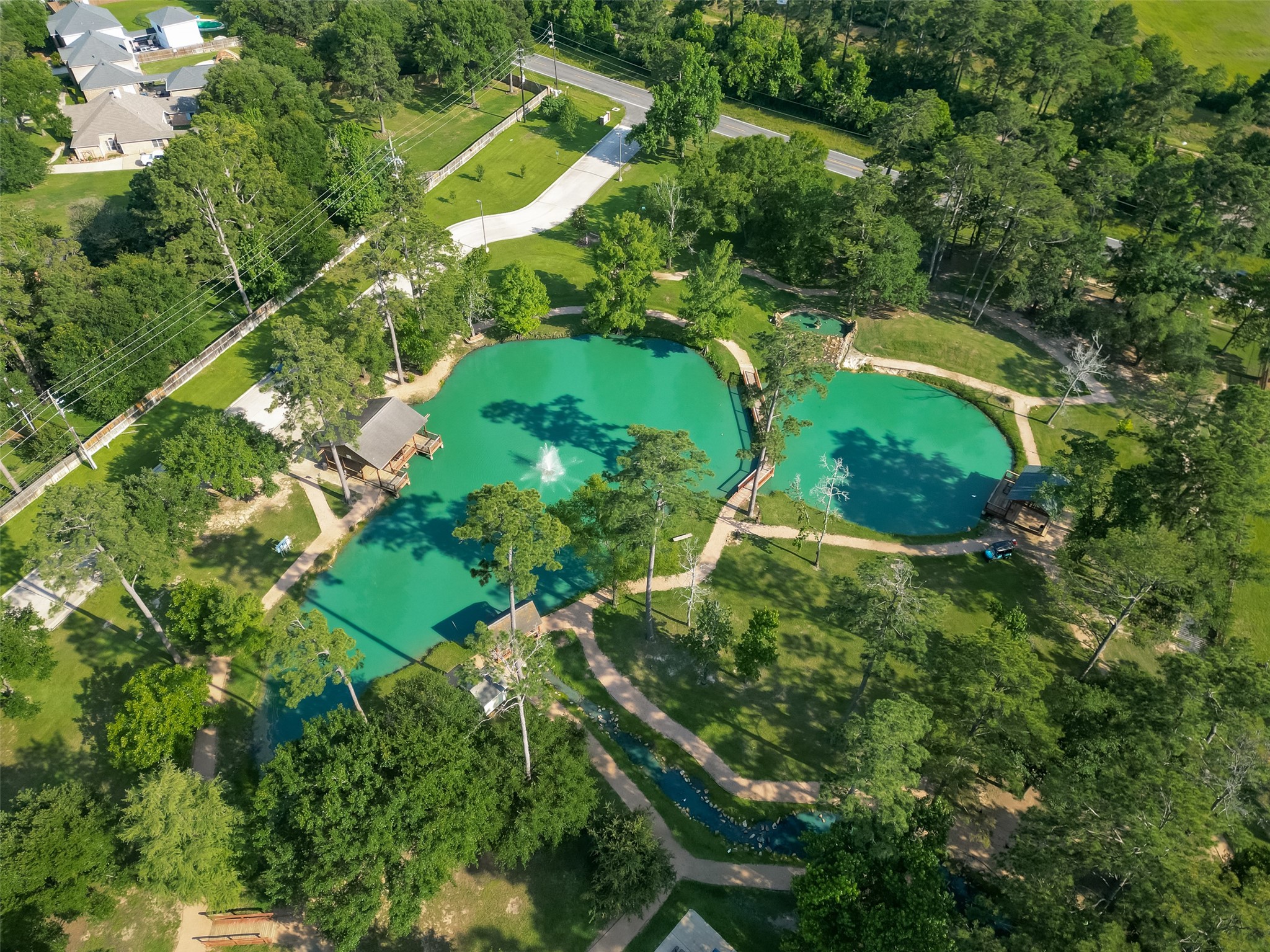 6131 Hampton Way Court Spring, TX 77389 - Photo 48 of 50 an aerial view of a house with a yard and large trees