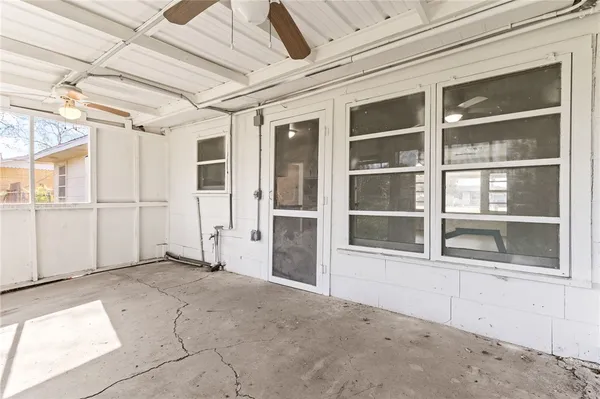 a view of an empty room with a window