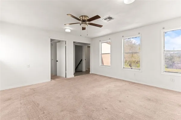 a view of an empty room with a window