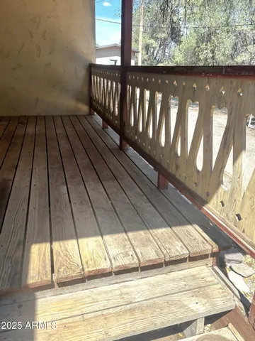 a view of a house with a yard and wooden fence