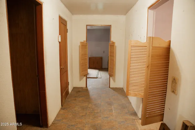 a view of a house with a wooden fence