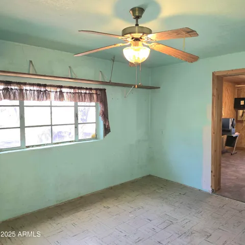 a backyard of a house with yard and tree