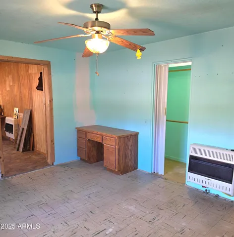 a view of hallway with stairs and furniture