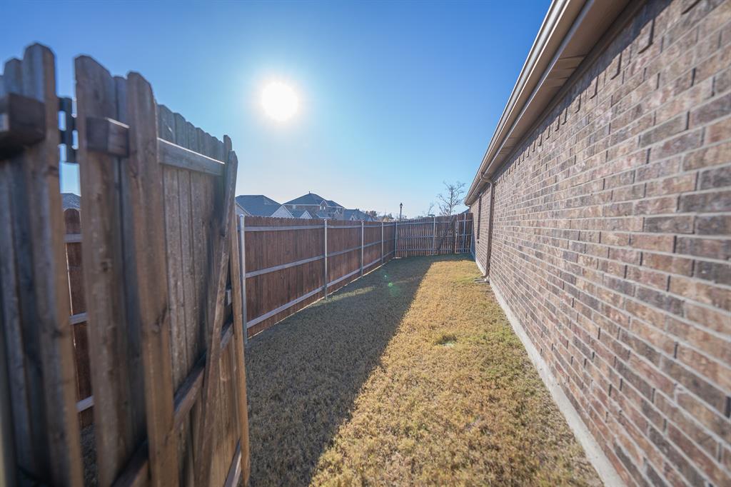 400 Willow View Way Princeton, TX 75407 - Photo 16 of 38 a view of a pathway with a wrought fence