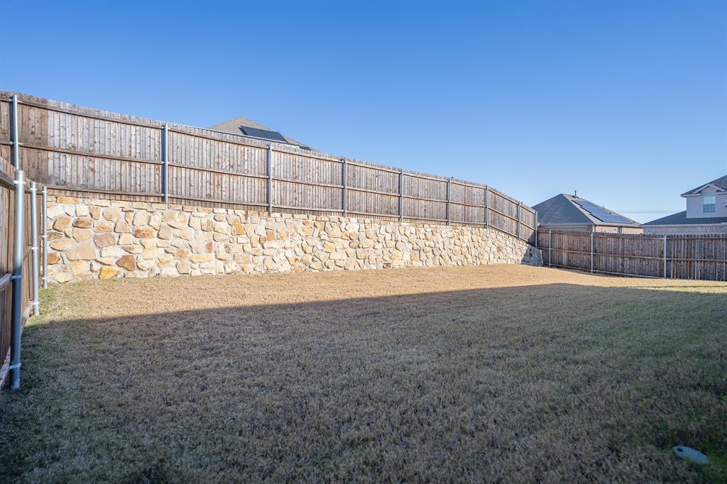 400 Willow View Way Princeton, TX 75407 - Photo 19 of 38 a view of backyard with wooden fence