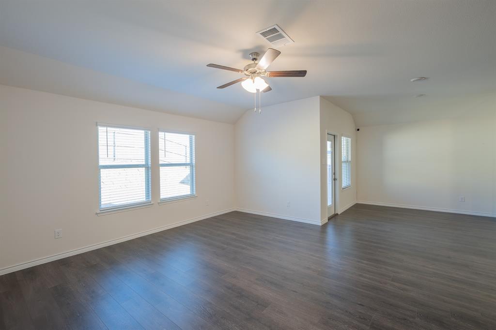 400 Willow View Way Princeton, TX 75407 - Photo 26 of 38 a view of an empty room with wooden floor and a window