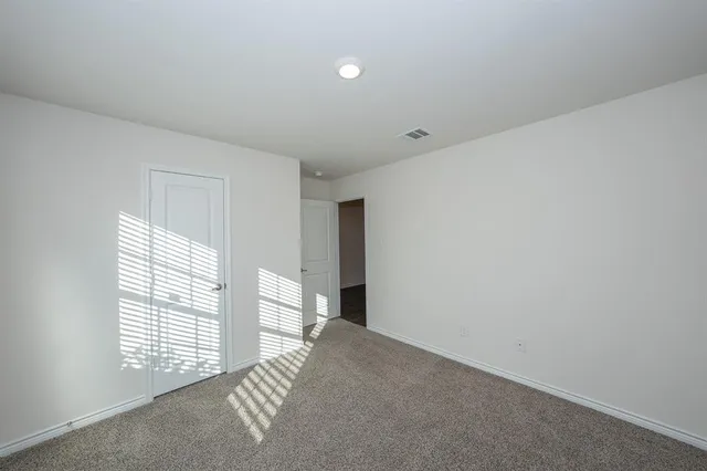a view of empty room with windows