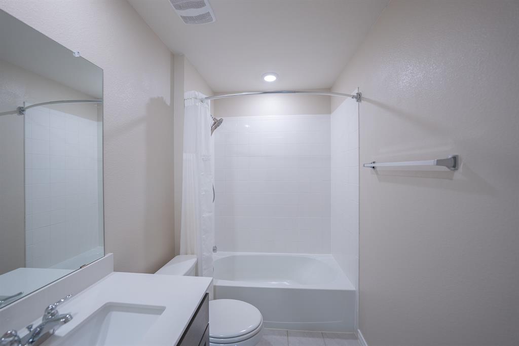 400 Willow View Way Princeton, TX 75407 - Photo 10 of 38 a bathroom with a granite countertop bathtub shower sink vanity and toilet