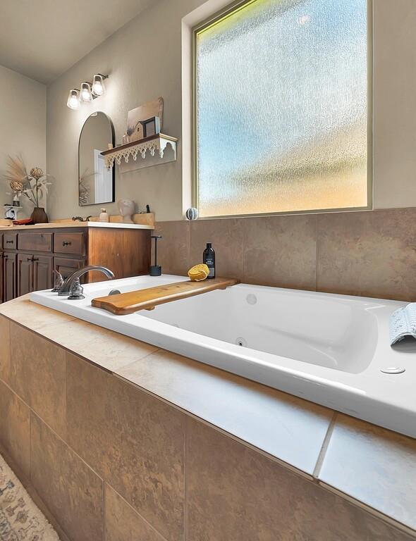 550 Hunton Lane Robinson, TX 76706 - Photo 18 of 35 Full bath featuring vanity and a jetted tub