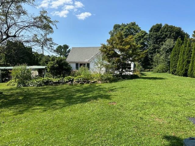 49 Hickory Drive Brewster, NY 10509 - Photo 15 of 17 a view of backyard of house with green space