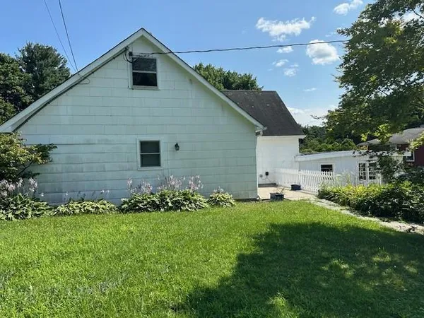 a front view of house with garden