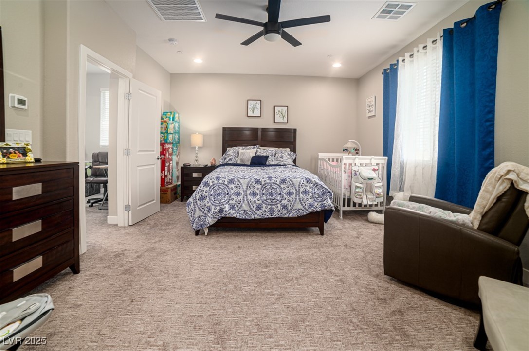 111 Verde Rosa Drive Henderson, NV 89011 - Photo 17 of 51 Bedroom featuring multiple windows, light colored carpet, ceiling fan, and recessed lighting