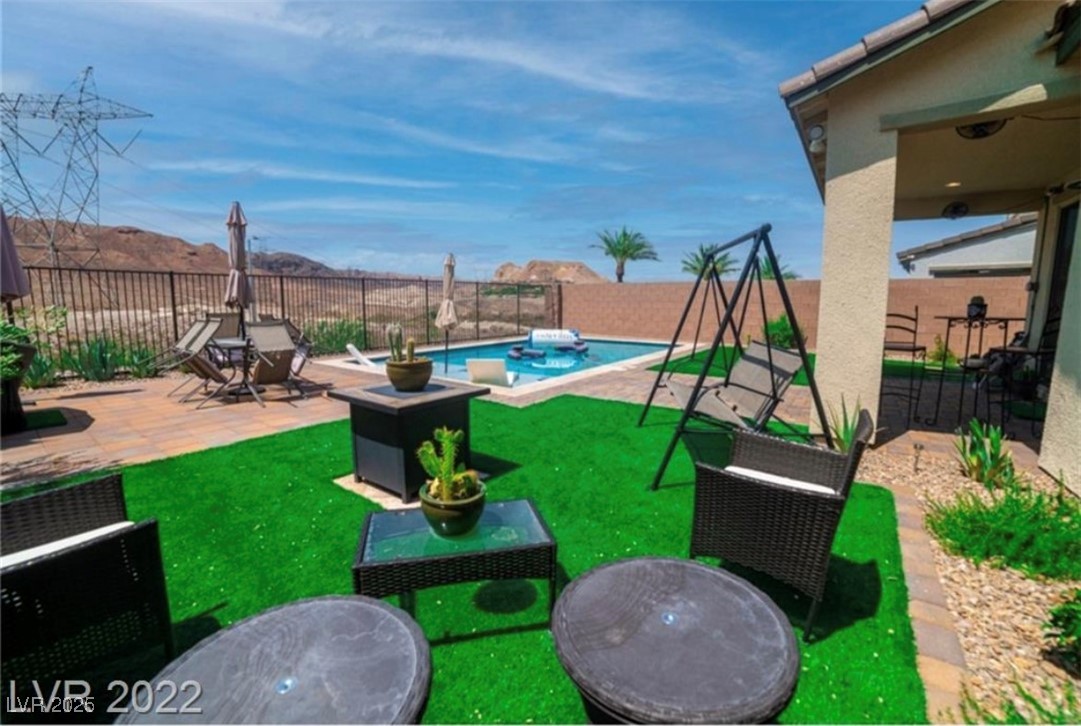 111 Verde Rosa Drive Henderson, NV 89011 - Photo 2 of 51 View of playground with a patio area and a fenced backyard