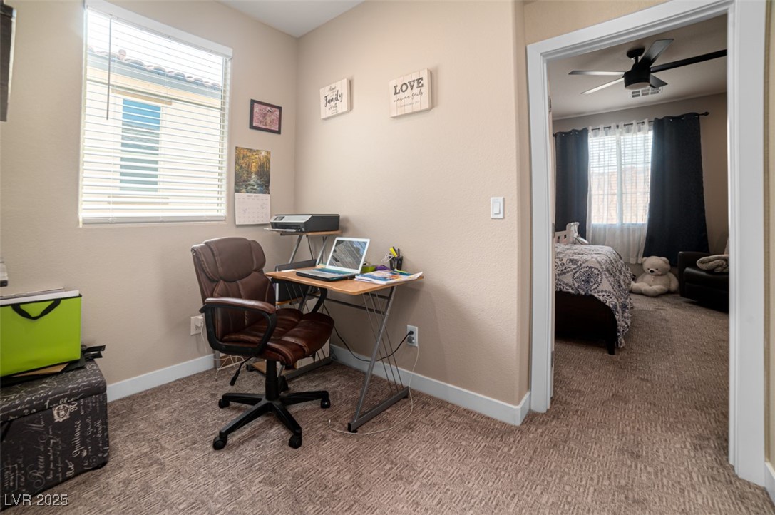 111 Verde Rosa Drive Henderson, NV 89011 - Photo 28 of 51 Home office with light carpet and ceiling fan