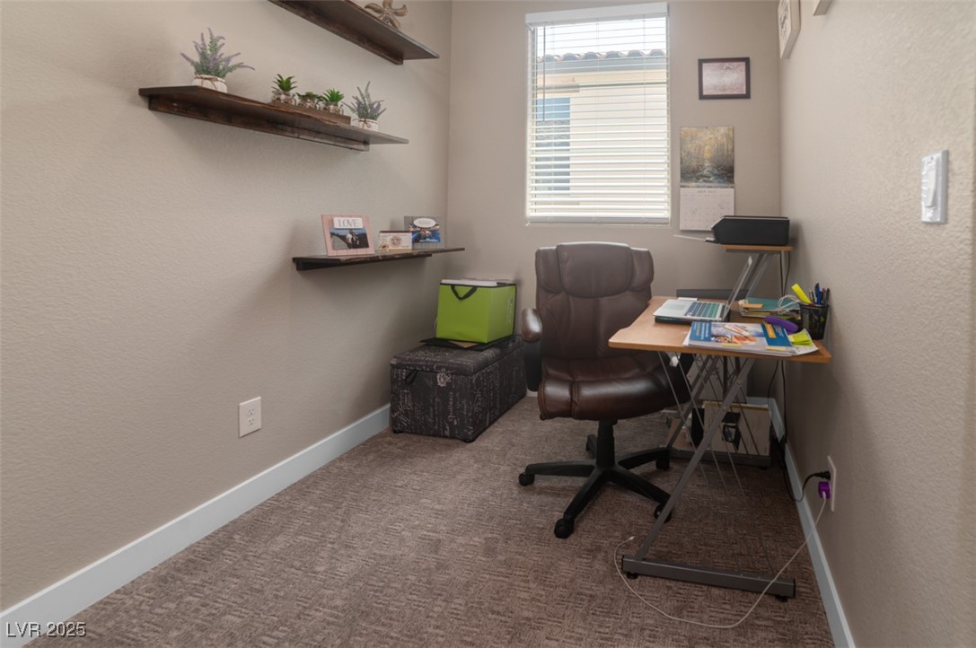 111 Verde Rosa Drive Henderson, NV 89011 - Photo 29 of 51 Home office with a textured wall and light colored carpet