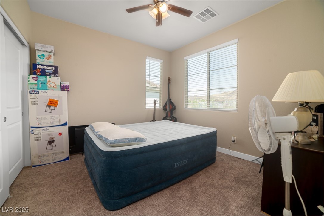 111 Verde Rosa Drive Henderson, NV 89011 - Photo 33 of 51 Carpeted bedroom featuring a ceiling fan and a closet