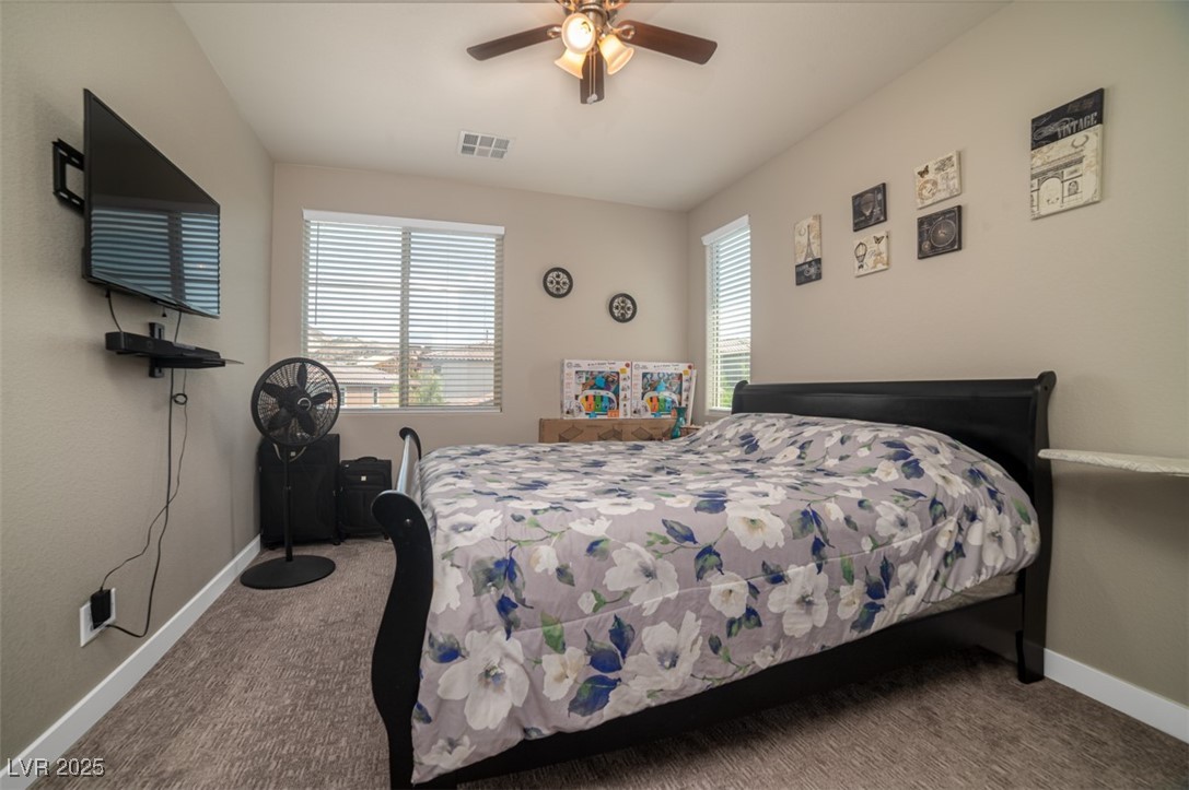 111 Verde Rosa Drive Henderson, NV 89011 - Photo 35 of 51 Bedroom with carpet and ceiling fan