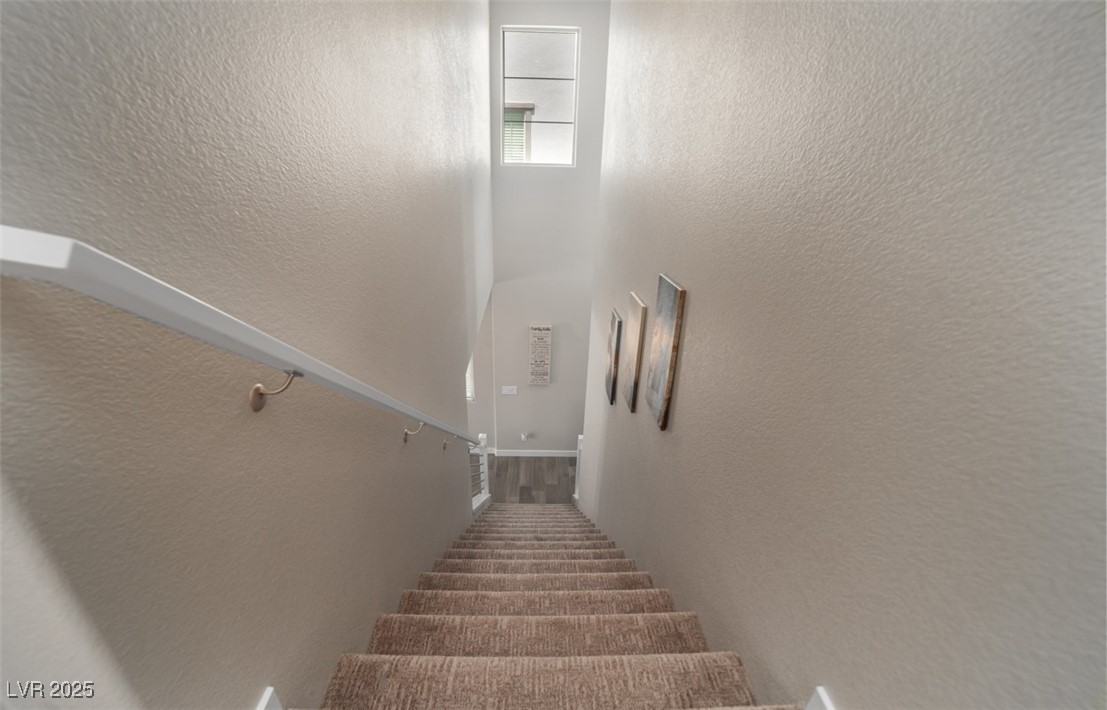 111 Verde Rosa Drive Henderson, NV 89011 - Photo 40 of 51 Stairway with a textured wall
