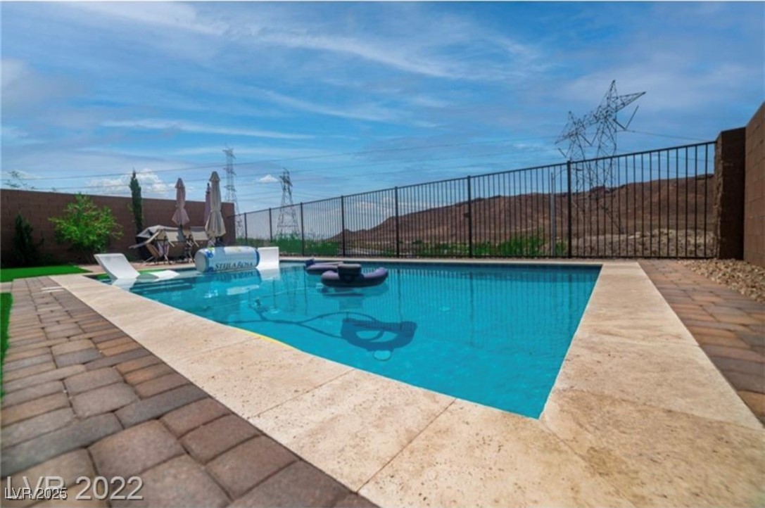 111 Verde Rosa Drive Henderson, NV 89011 - Photo 45 of 51 View of pool with a fenced backyard and a patio area