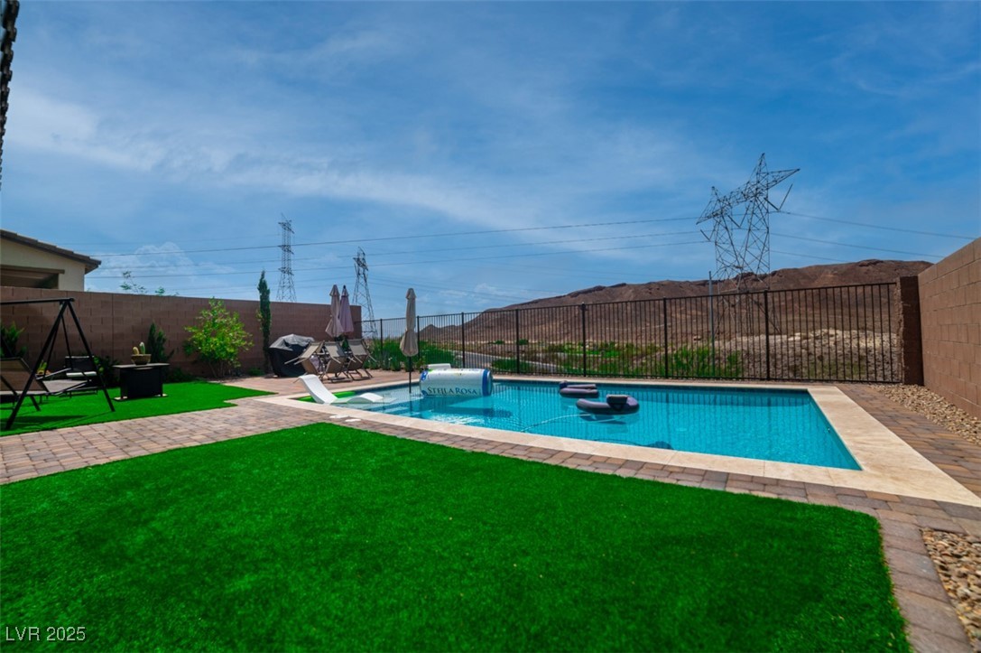 111 Verde Rosa Drive Henderson, NV 89011 - Photo 47 of 51 View of swimming pool with a patio area and a fenced backyard