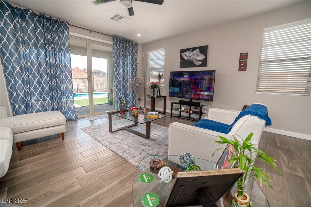 111 Verde Rosa Drive Henderson, NV 89011 - Photo 9 of 51 Living area featuring wood finished floors, recessed lighting, and ceiling fan