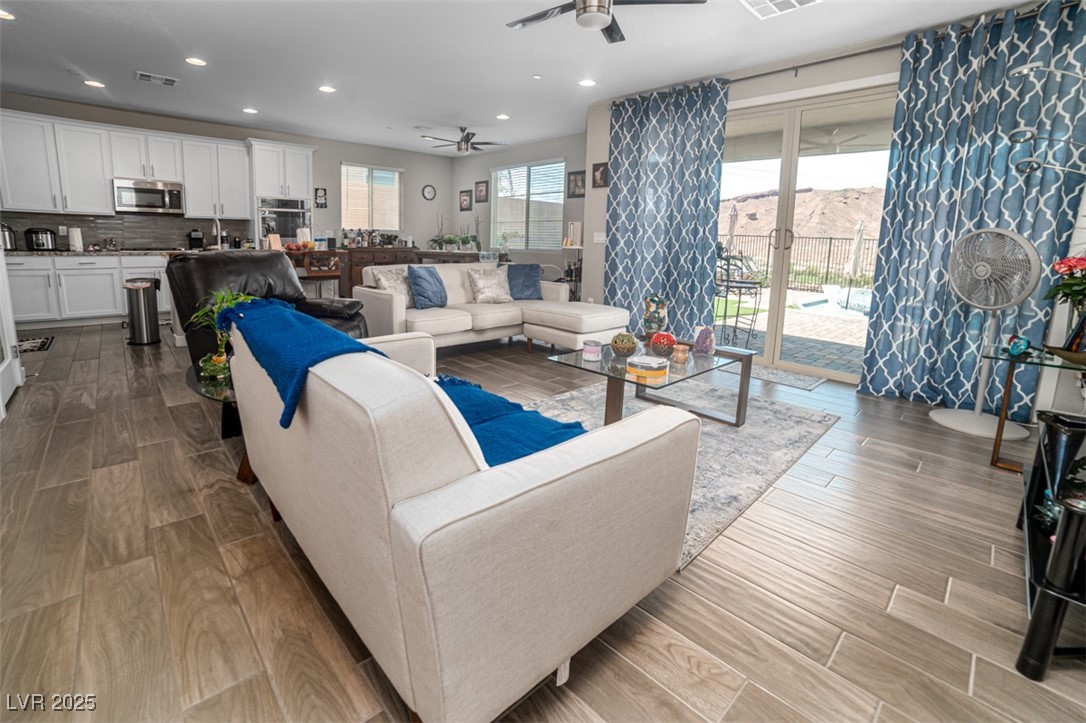 111 Verde Rosa Drive Henderson, NV 89011 - Photo 10 of 51 Living area with wood tiled floors, ceiling fan, and recessed lighting