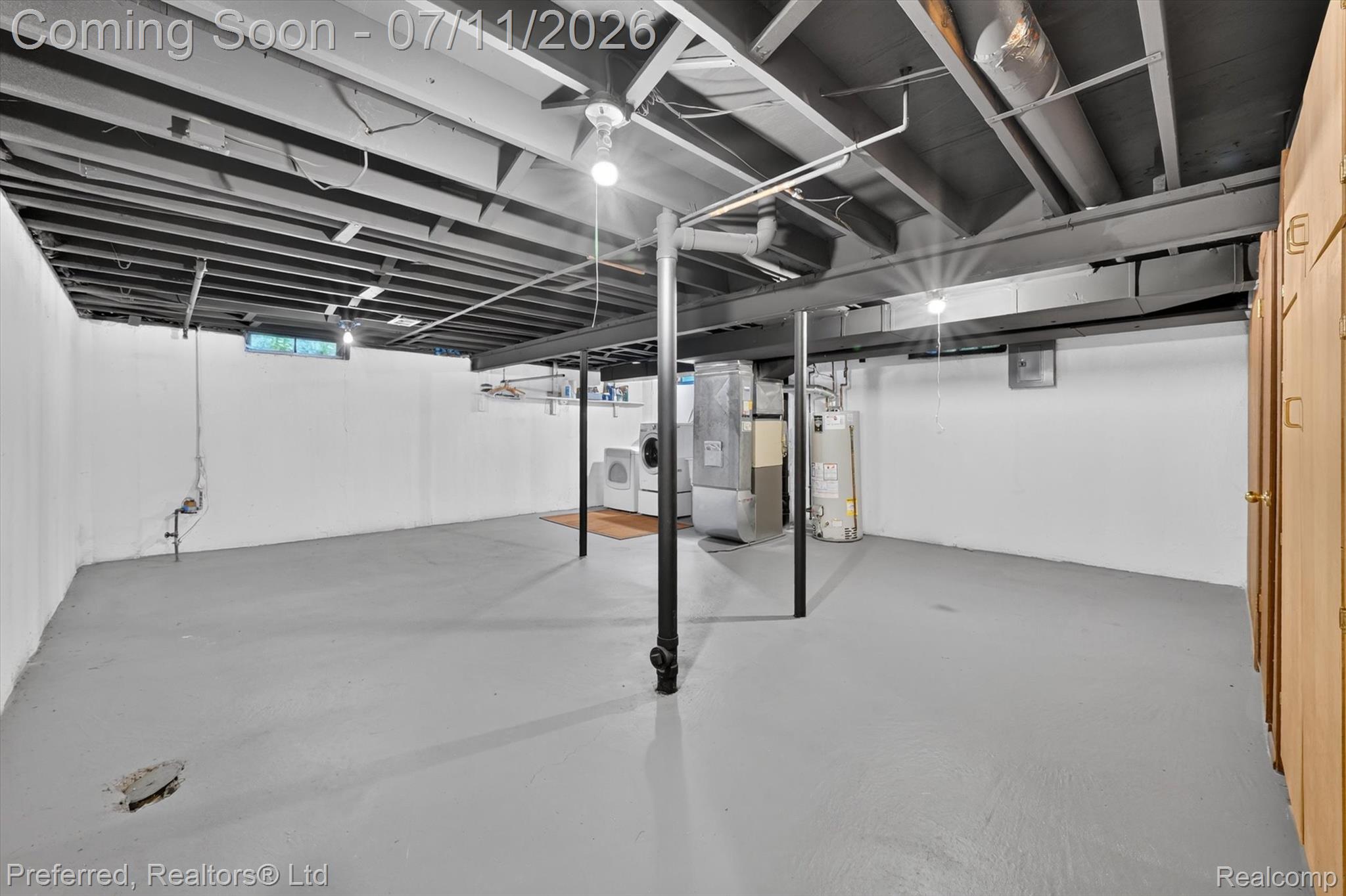 46596 Maidstone Road Canton, MI 48187 - Photo 40 of 61 Expansive basement space featuring painted concrete flooring, exposed ceiling beams, and white painted walls