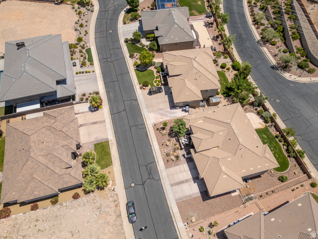 2005 West 450 S Circle St. George, UT 84770 - Photo 54 of 57 Spacious residential property featuring a multi-gabled roofline and an expansive driveway
