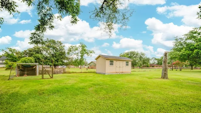 a view of an house with backyard space and garden