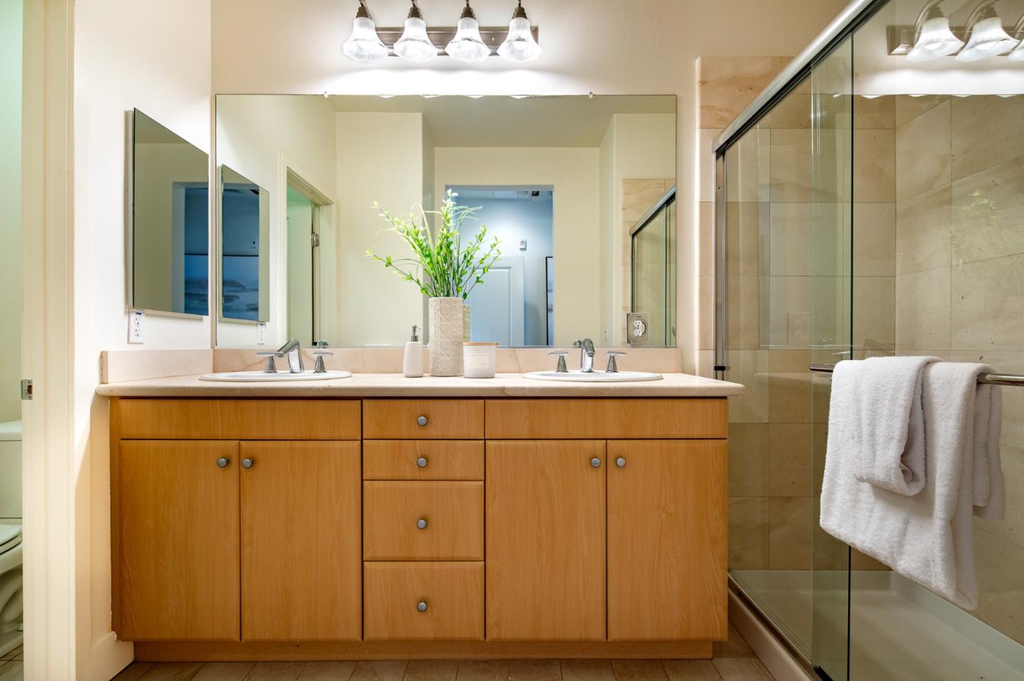 1003 Plover Lane Palo Alto, CA 94303 - Photo 12 of 14 a bathroom with a double vanity sink mirror and