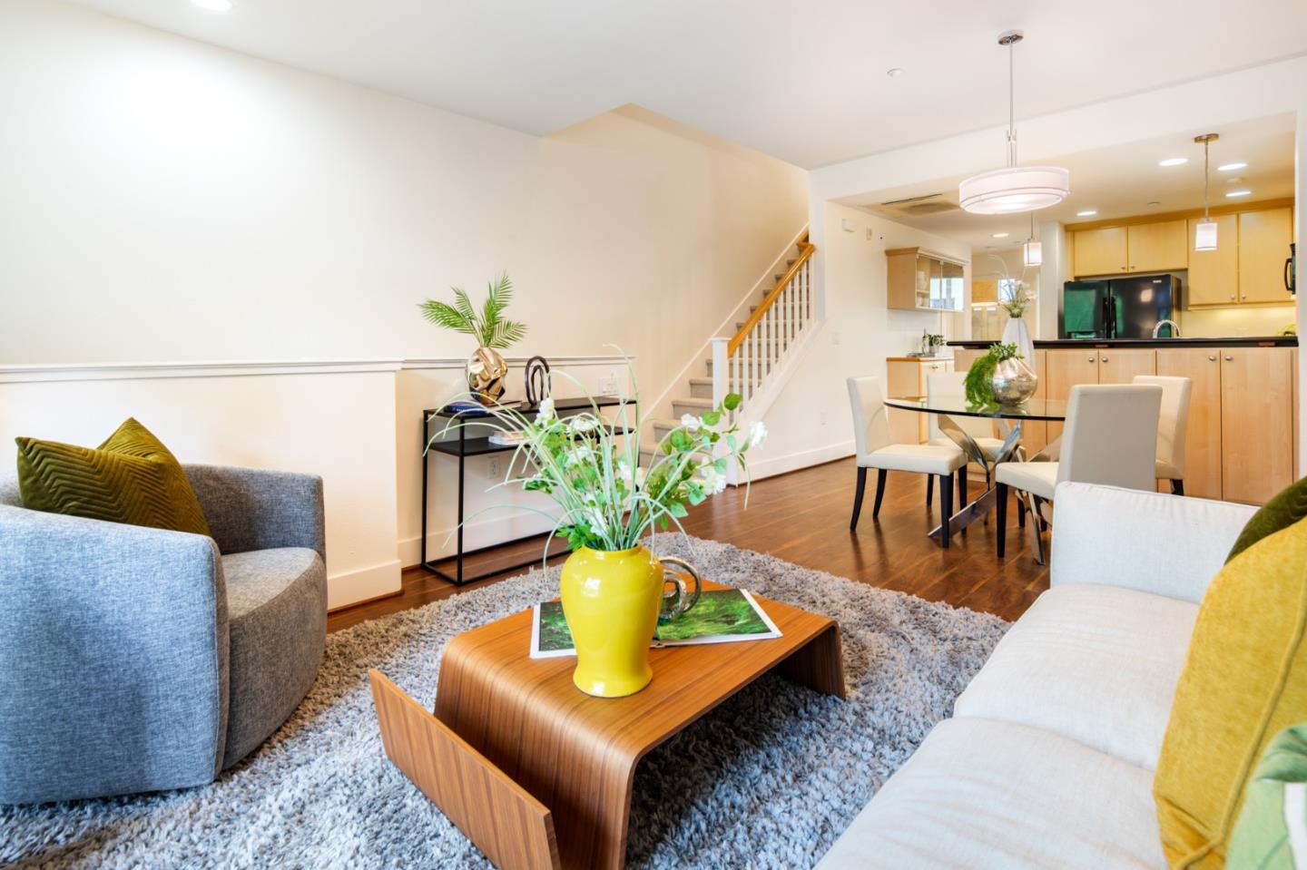 1003 Plover Lane Palo Alto, CA 94303 - Photo 3 of 14 a living room with furniture and a chandelier