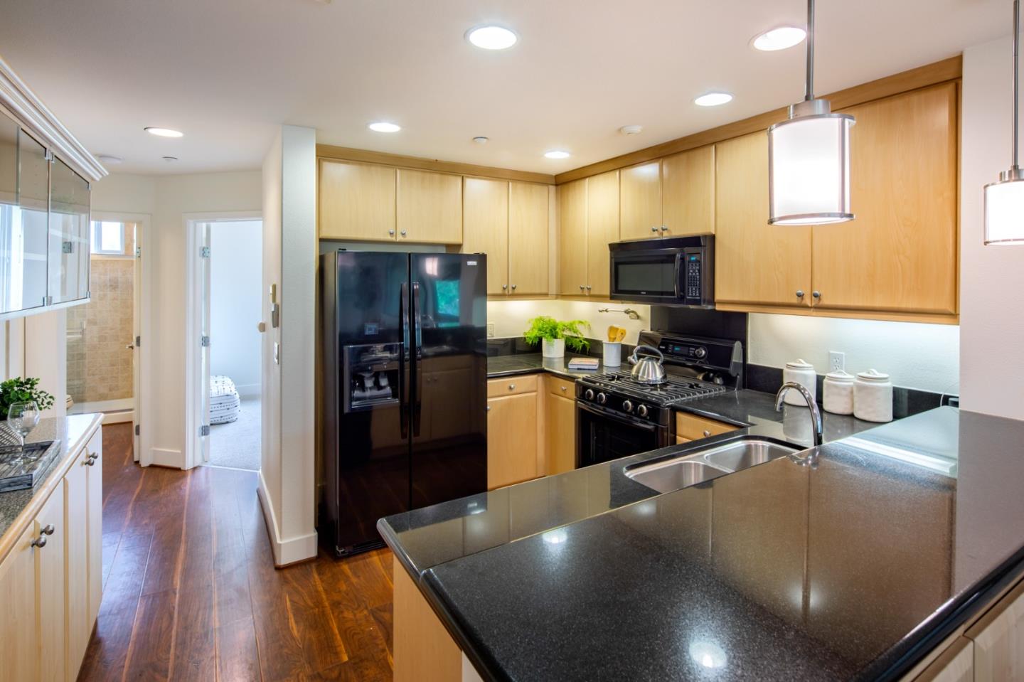 1003 Plover Lane Palo Alto, CA 94303 - Photo 5 of 14 a kitchen with stainless steel appliances a refrigerator and a stove top oven