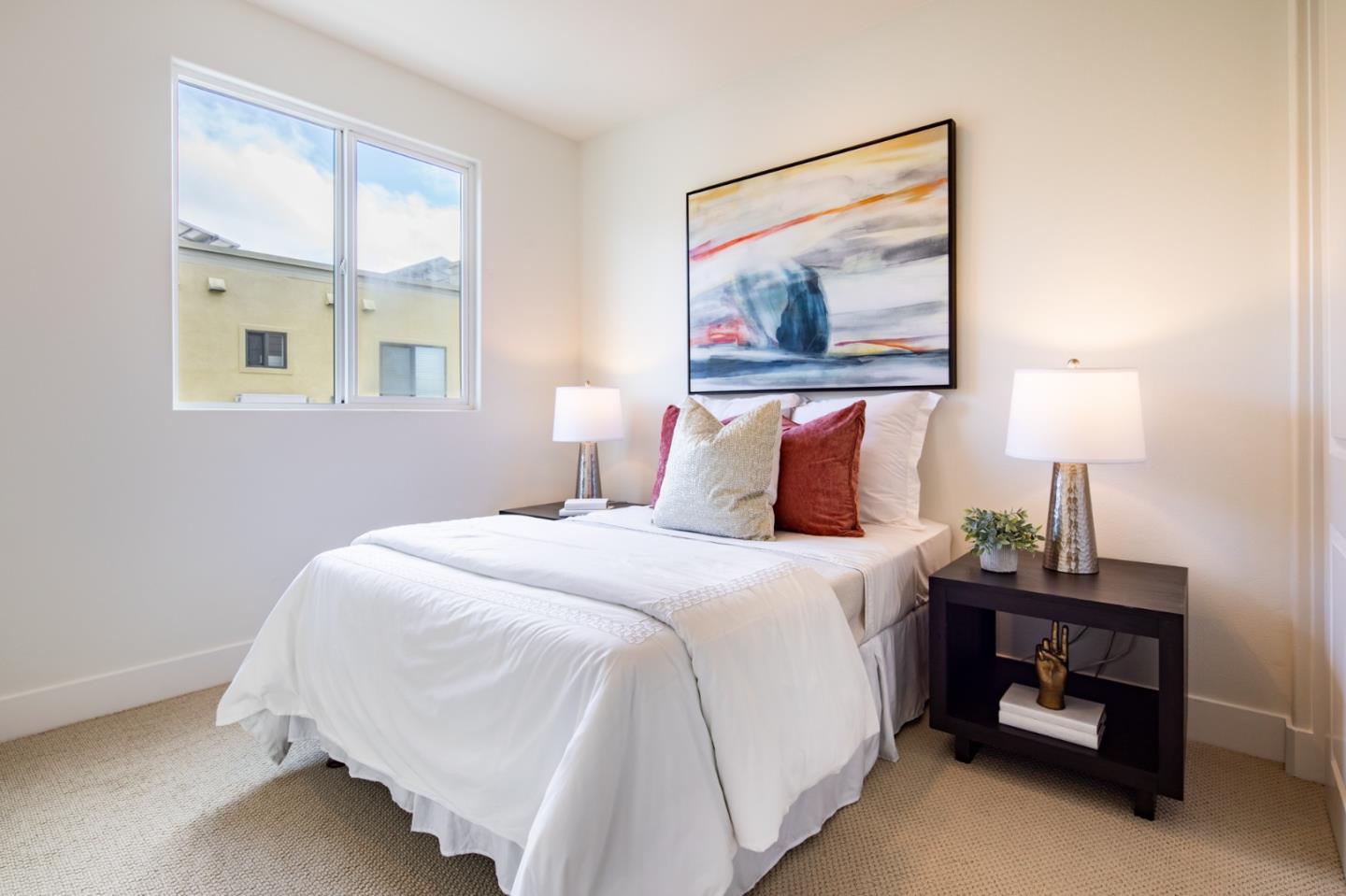 1003 Plover Lane Palo Alto, CA 94303 - Photo 8 of 14 a bedroom with a bed and a painting on the wall