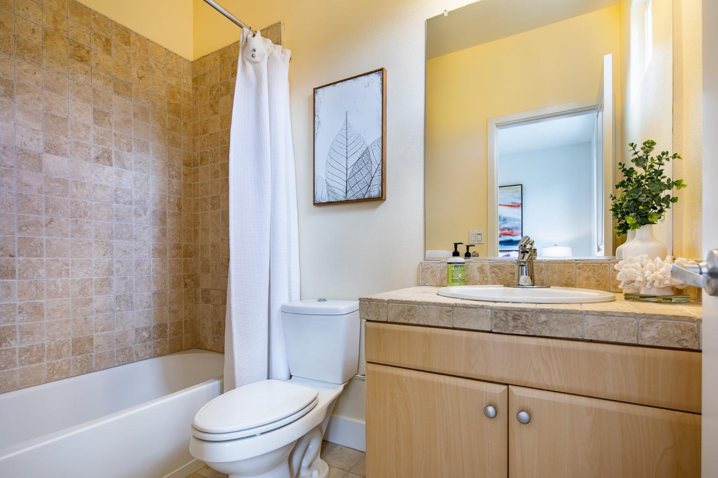 1003 Plover Lane Palo Alto, CA 94303 - Photo 9 of 14 a bathroom with a sink a toilet and shower