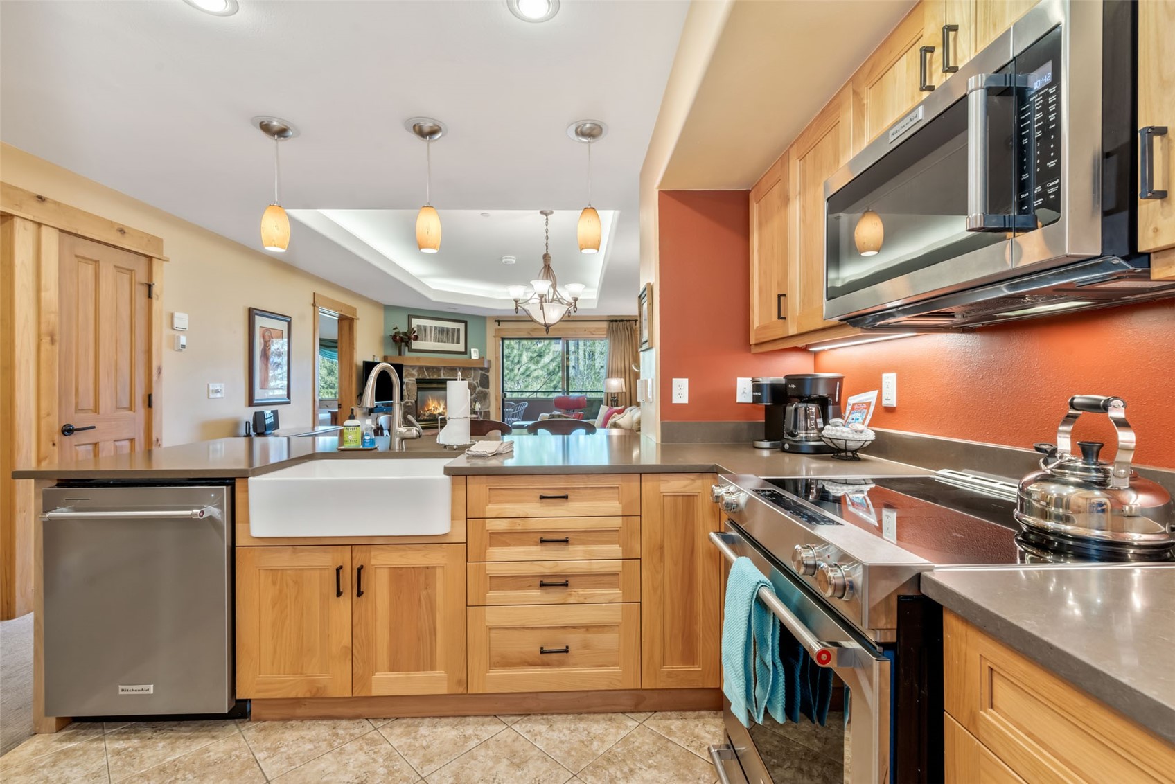 2720 Eagle Ridge Drive, Unit 207 Steamboat Springs, CO 80487 - Photo 13 of 37 a kitchen with stainless steel appliances granite countertop a stove and a microwave