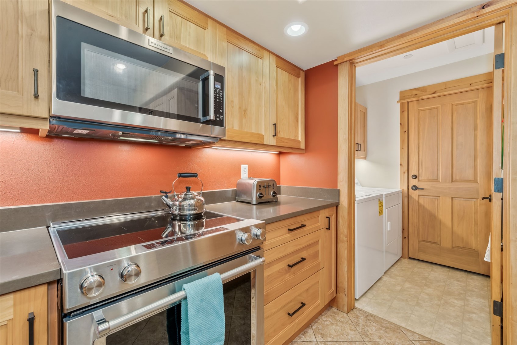2720 Eagle Ridge Drive, Unit 207 Steamboat Springs, CO 80487 - Photo 14 of 37 a kitchen with a sink and a stove top oven